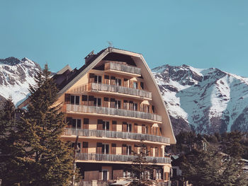 Chalet against clear sky during winter in auron