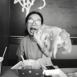 Portrait of happy boy on table