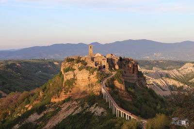 Castle on mountain against sky