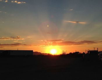 Scenic view of landscape against sky at sunset