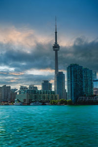 View of city at waterfront against sky