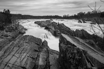 Panoramic view of waterfall against sky