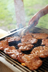 Cropped hand of man preparing food