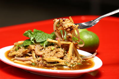 Close-up of noodles in bowl on table