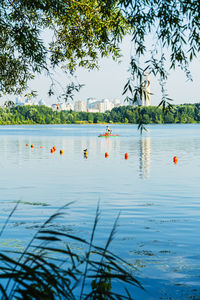 Scenic view of swimming pool by lake against sky