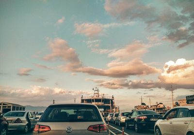 Cars on road at sunset