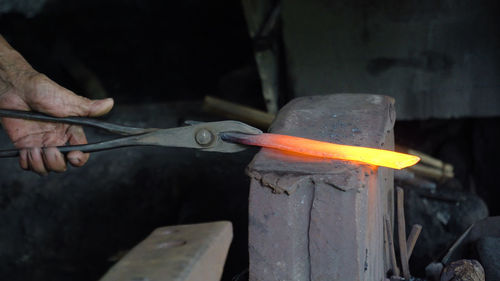 Hot metal is processed on the anvil in the forge. anvil in the forge