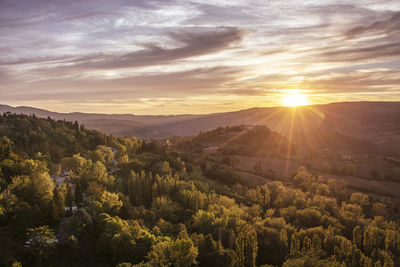 Scenic view of mountains against sky during sunset