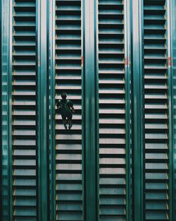 Directly above shot of man standing on escalator