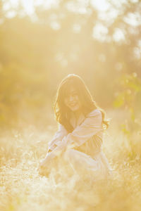 Portrait of woman on field