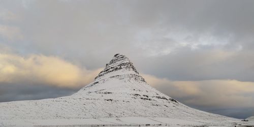 Scenic view of snowcapped mountain against sky