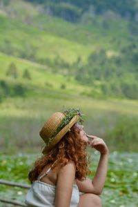 Low section of woman wearing hat