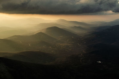 Scenic view of mountains against sky during sunset