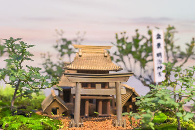 Built structure on field against sky