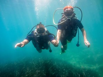 People swimming in sea