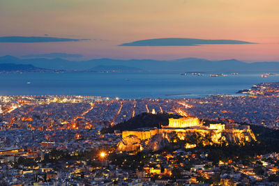 High angle view of illuminated buildings in city at night