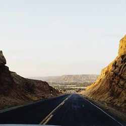 Road amidst landscape against clear sky