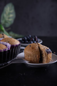 Delicious homemade cupcakes filled with blueberries and presented in small molds.