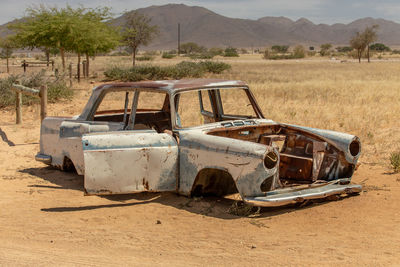 Abandoned car on road