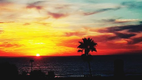 Scenic view of sea against orange sky