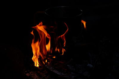 Close-up of bonfire on field at night