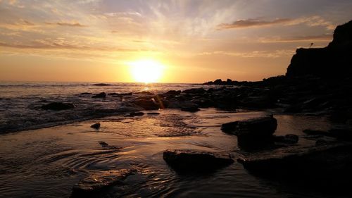 Scenic view of sea at sunset