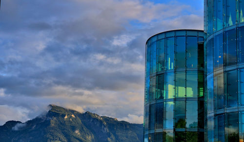 Low angle view of building against cloudy sky