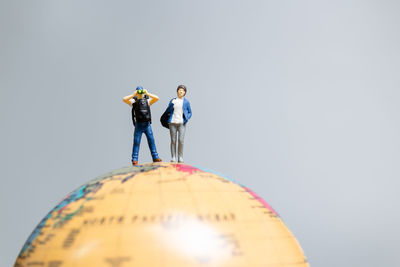 Low angle view of figurines against clear sky