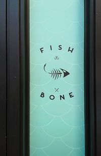 Close-up of text on glass window