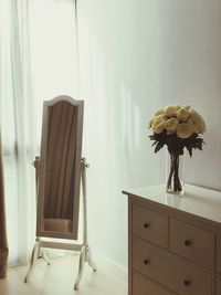 Flower vase on table at home