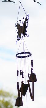 Low angle view of clothes hanging against sky