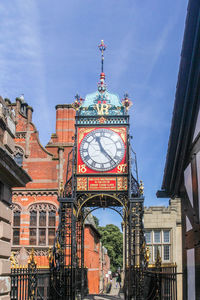 Low angle view of clock tower in city