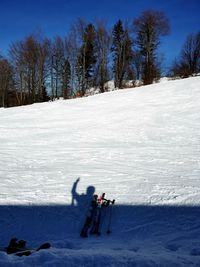 People skiing on snow covered skislope