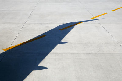 Shadow of airplane on runway