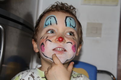 Portrait of young boy, carnival  clown