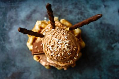 Chocolate ice cream balls based on waffle accompanied by chocolate chunks. summer concept