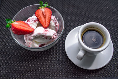 A cup of coffee with some strawberry on different background