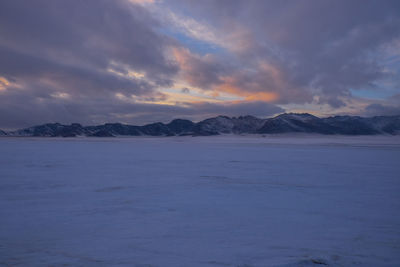 Scenic view of mountains against sky during sunset