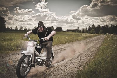 Person riding motorcycle on grass