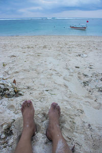 Low section of person on beach