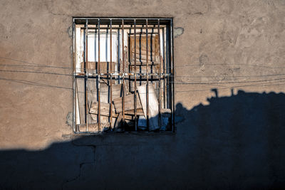 Low angle view of window on wall