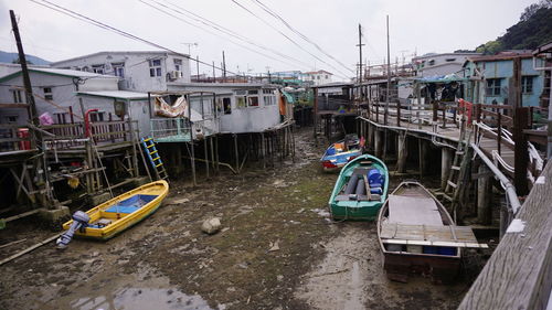 Boats moored at shore against sky