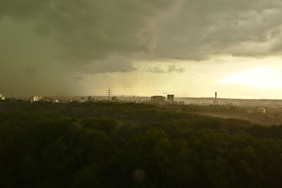 View of factory against cloudy sky