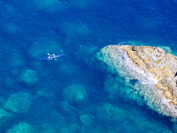 High angle view of man kayaking in sea