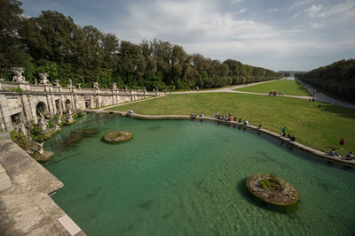 Scenic view of swimming pool by river against sky