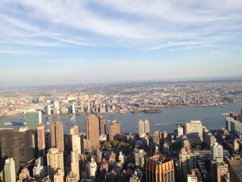 High angle view of modern buildings in city against sky