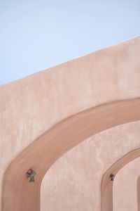 Low angle view of wall against clear sky