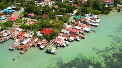 Village of fishermen with houses on the water, with fishing boats in tagbilaran city. 