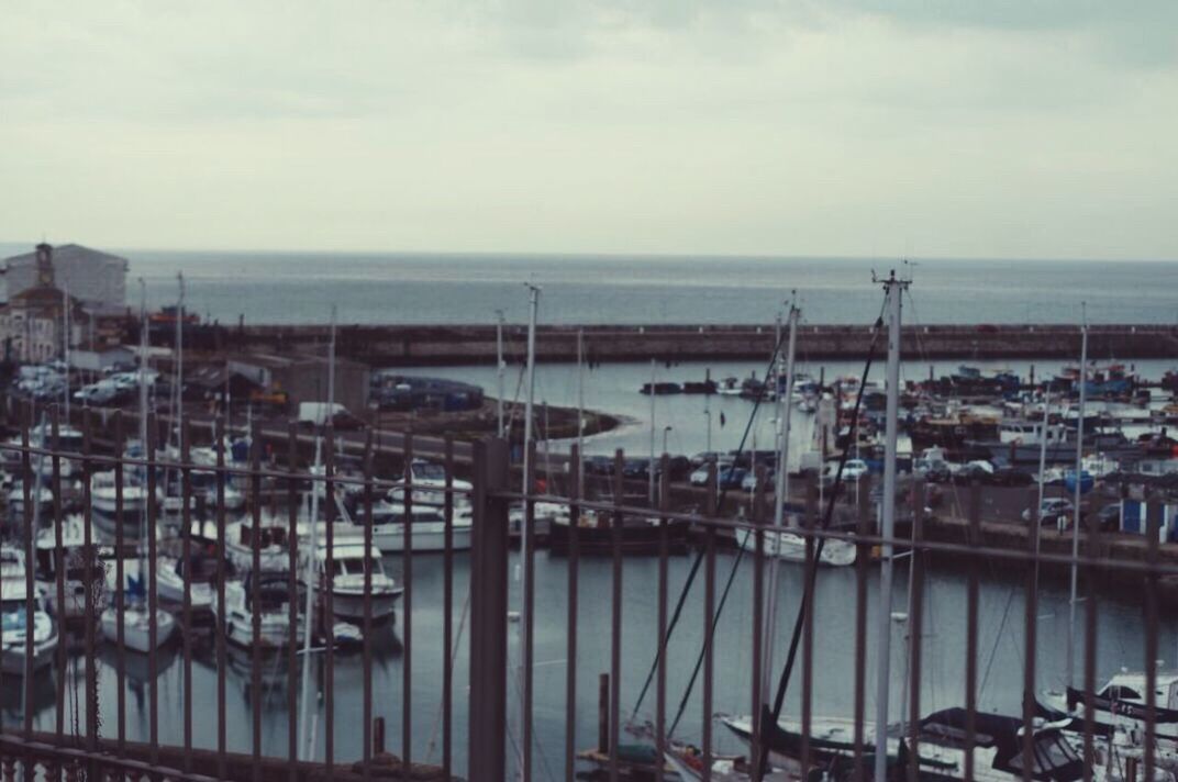 water, sea, no people, outdoors, day, nautical vessel, sky, high angle view, nature, transportation, building exterior, built structure, architecture, moored, horizon over water, harbor, beauty in nature