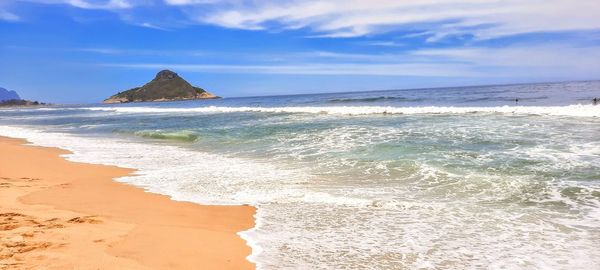 Scenic view of beach against sky